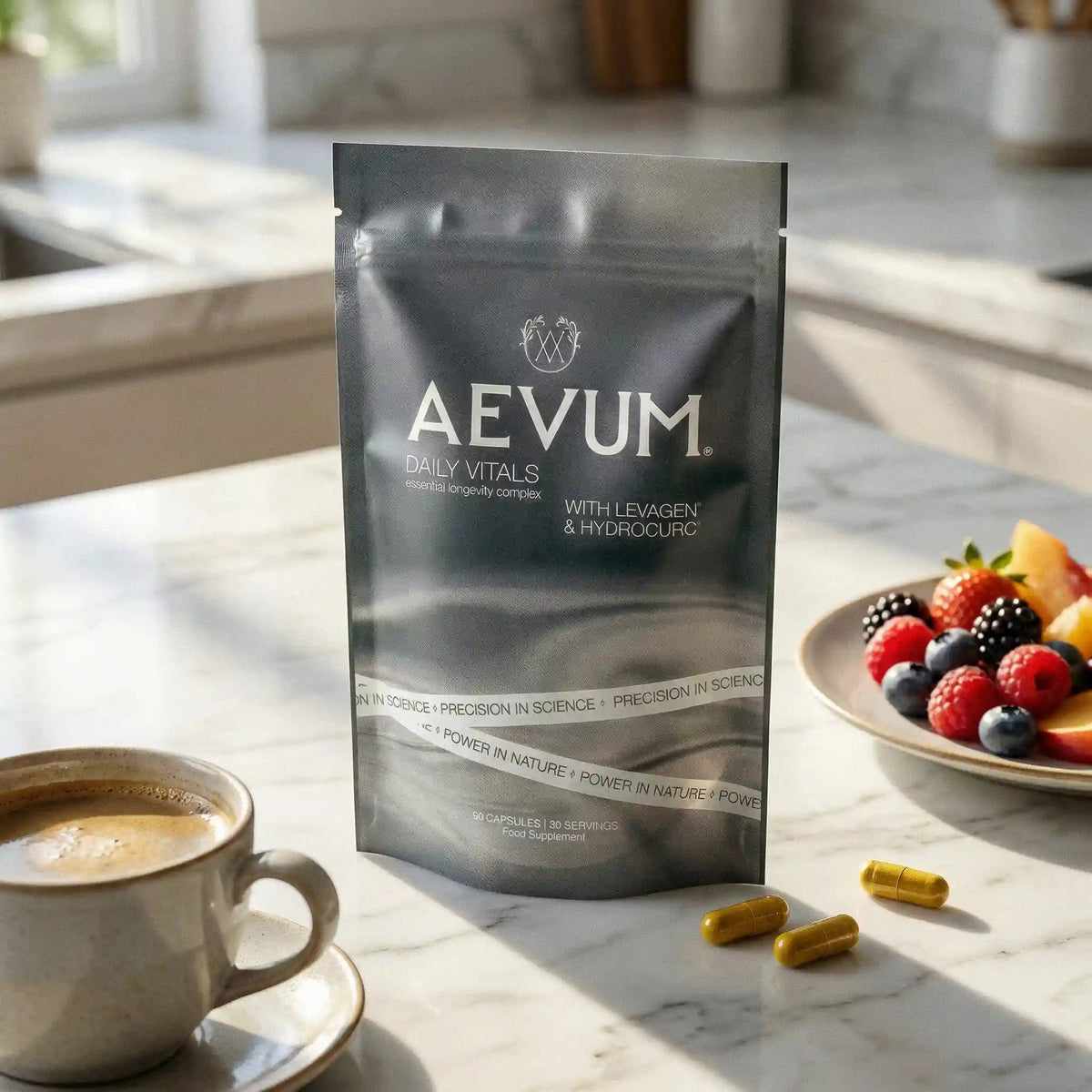 AEVUM Daily Vitals pouch on kitchen counter with coffee and fresh berries