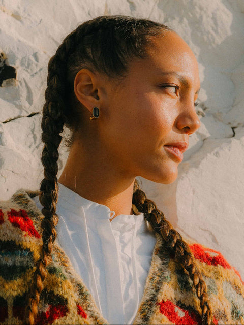 Woman with braided hair representing AEVUM's inflammation balance pillar