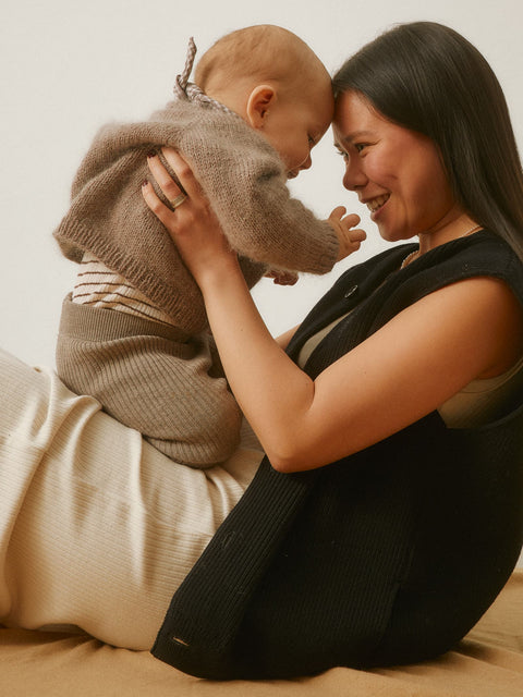 Mother and baby representing AEVUM's nervous system regulation pillar