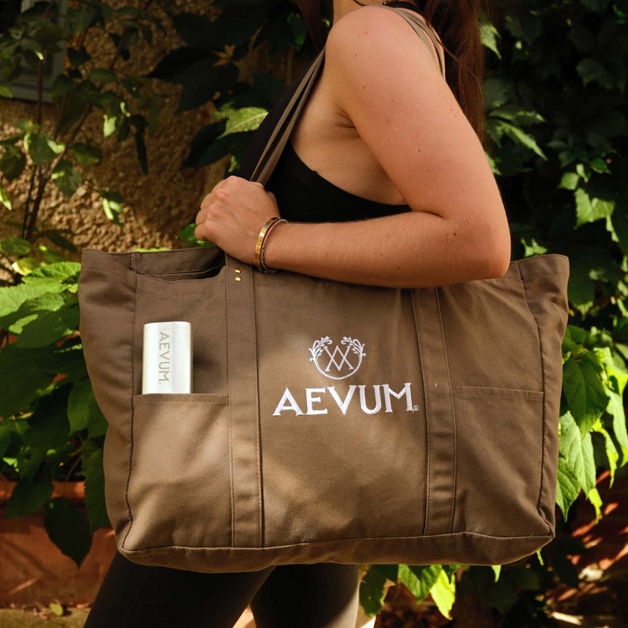 AEVUM travel pill case in AEVUM branded tote bag