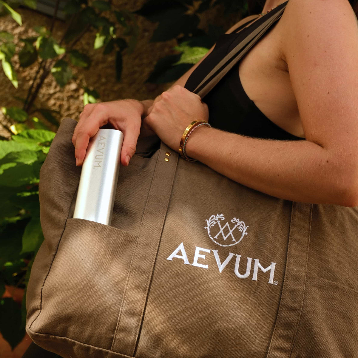 AEVUM travel pill case in AEVUM branded tote bag